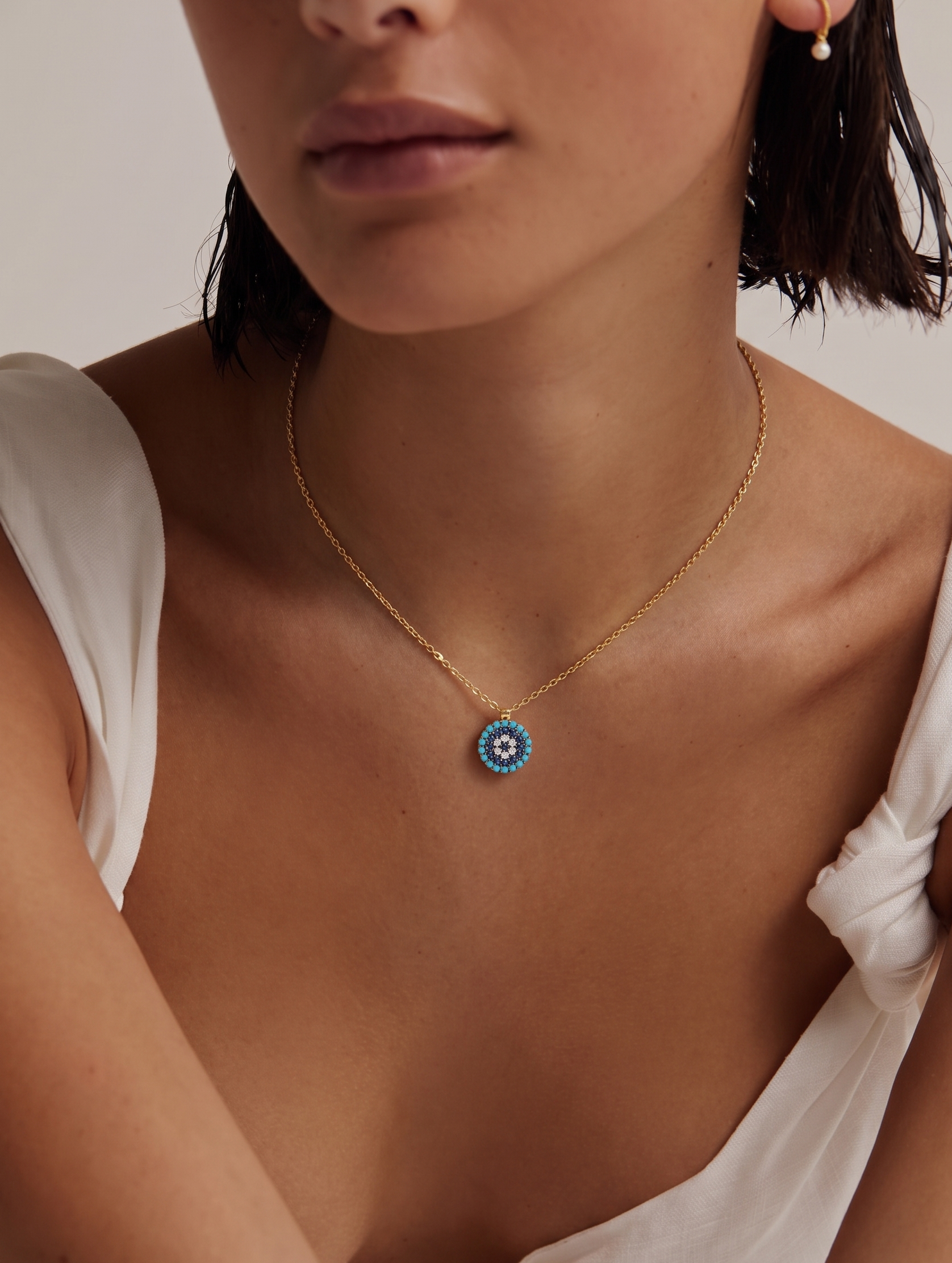 TURQUOISE, DIAMOND AND SAPPHIRE EVIL EYE NECKLACE