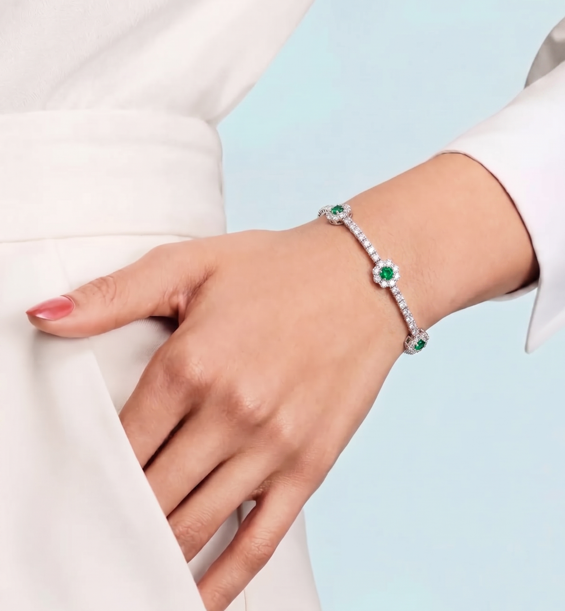DIAMOND AND EMERALD FLOWER TENNIS BRACELET